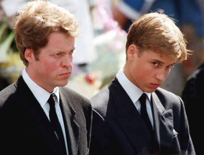 The son of Diana, Prince William (R), and her brother Earl Spencer wait in front of Westminster Abbey in London to attend the funeral ceremony of the Princess of Wales