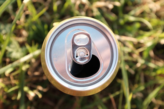 Directly Above Shot Of Open Beer Can On Grass