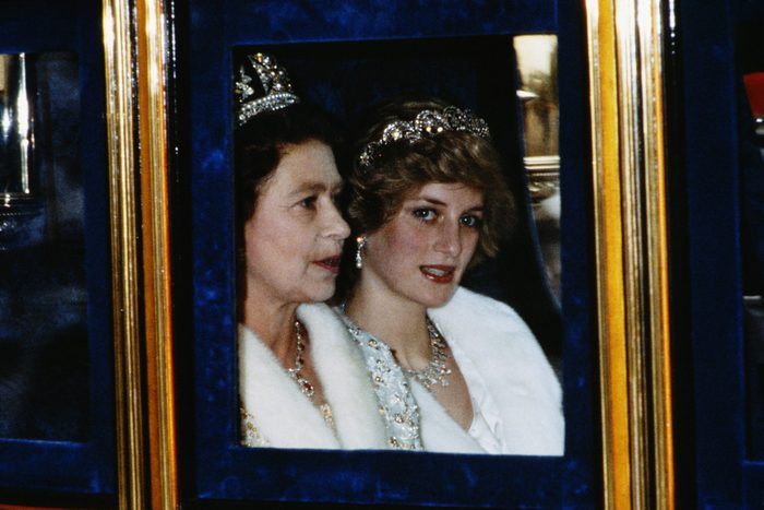 The Princess of Wales and the Queen attend the Opening of Parliament in London, November 1982. Diana is wearing a white fur coat and the Spencer tiara.