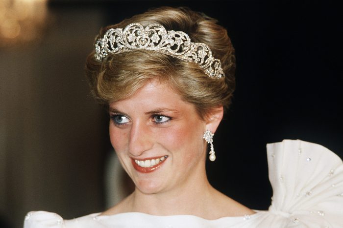 Diana, Princess of Wales, wearing a white dress designed by David and Elizabeth Emanuel with the Spencer Tiara, attends a State Banquet on November 16, 1986 in Bahrain.