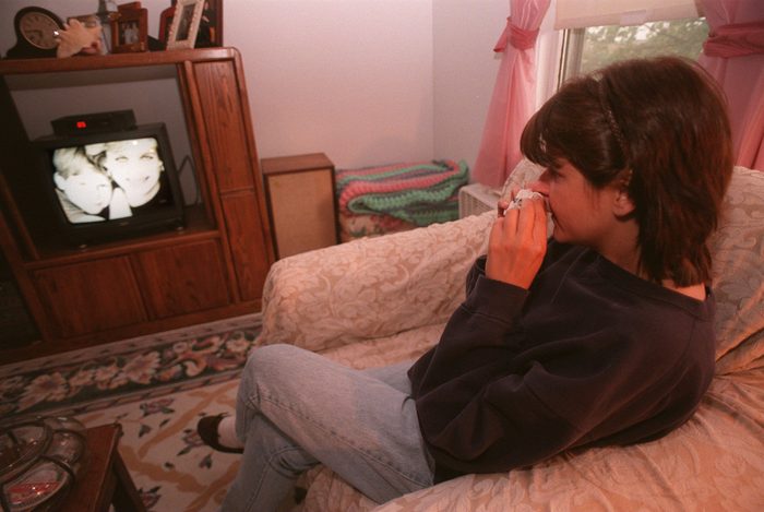 Christine Couture watches the televised funeral of Princess Diana of Wales in her living room in Arlington
