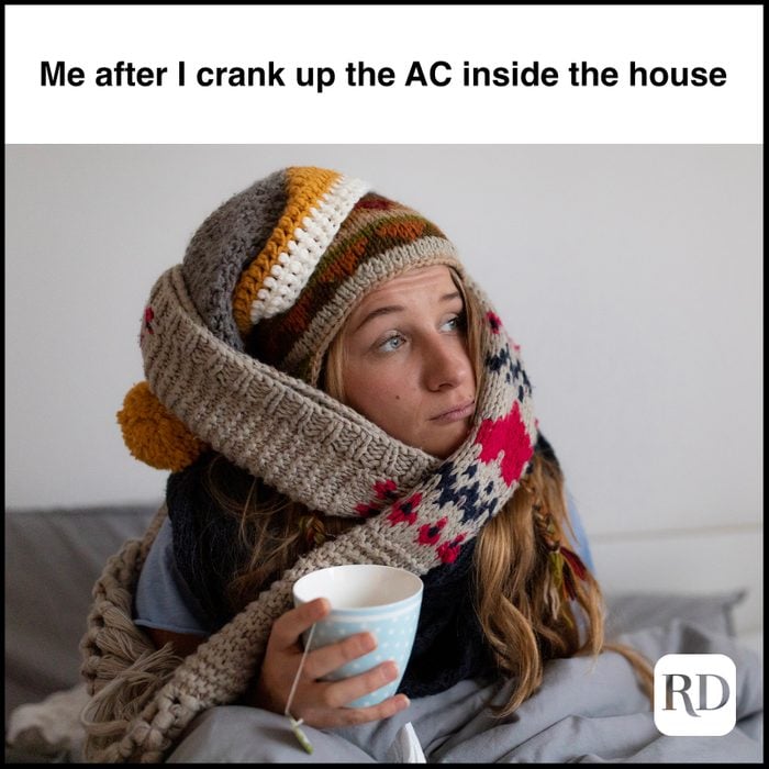 Woman bundled up in scarves MEME TEXT: Me after I crank up the AC inside the house