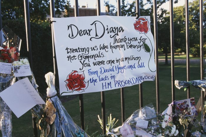 A note to Princess Diana is attached to a fence outside Westminster Abbey, on the day of Princess Diana's funeral reading "Dear Diana, Thank you for treating us like human beings not criminals. You were one in a million"