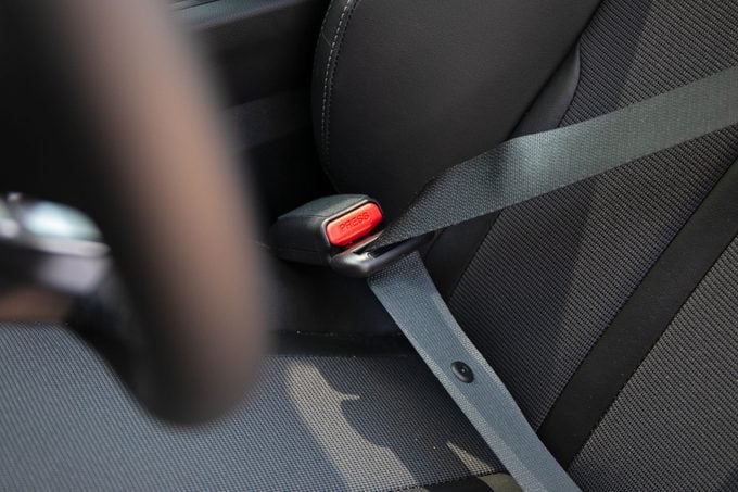 Drivers side of the car seatbelt with no fabric loop