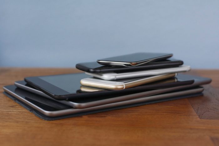 Stack of smart phones and digital tablets