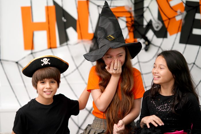 kids laughing playing truth or date at halloween party