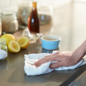 Cleaning kitchen with natural cleaning products.