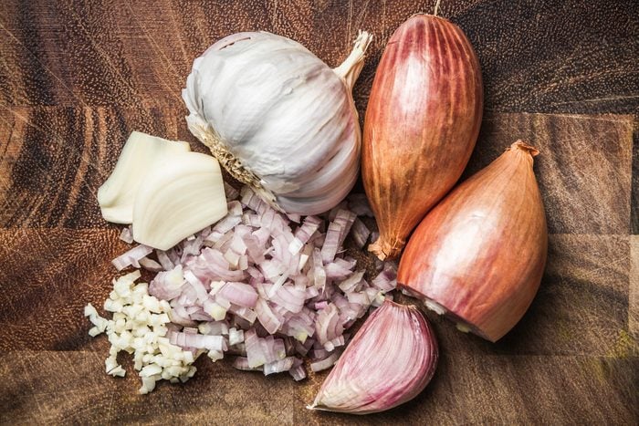 Ingredients for making green curry paste - onion, garlic