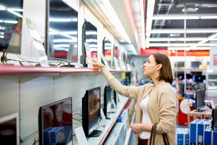 woman shopping for a television