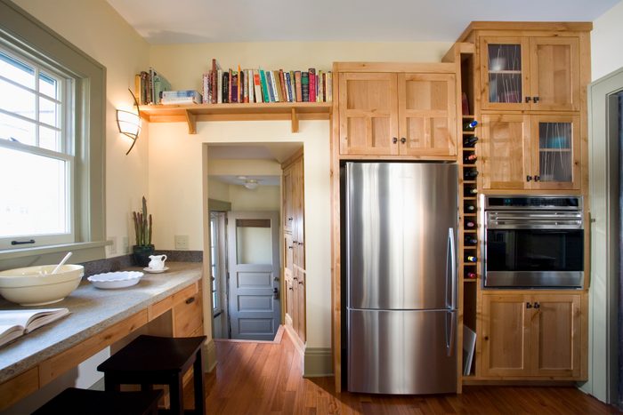 Back Door in Kitchen With Built-In Wood Cabinets