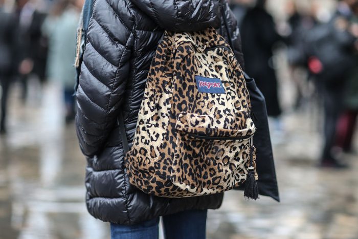 woman carrying jansport backpack