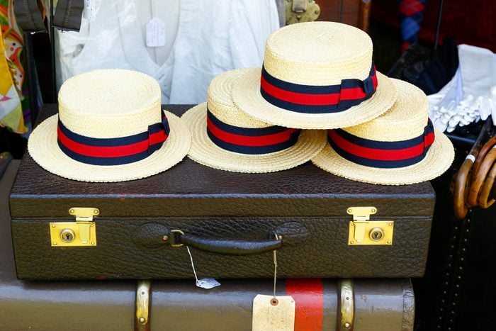 Straw hats on old-fashioned briefcase