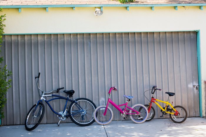 Bikes in front of a closed garage door