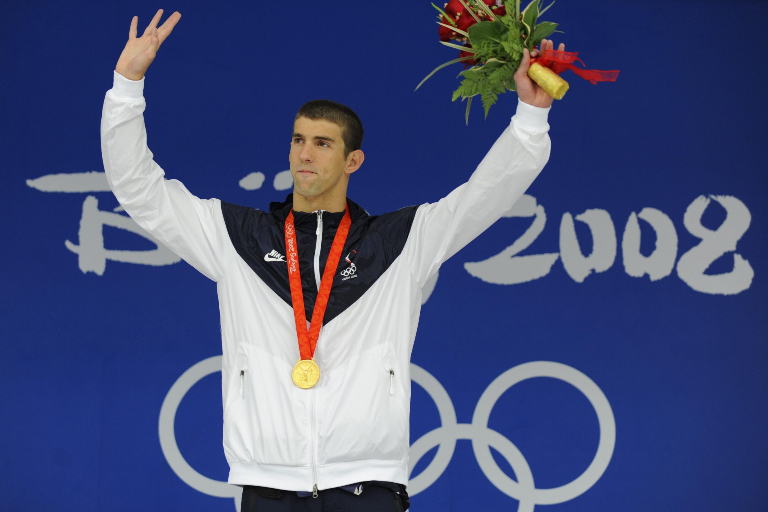 US swimmer Michael Phelps stands on the