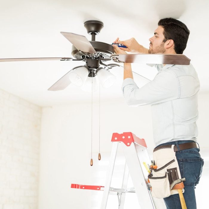 Handyman installing a ceiling fan
