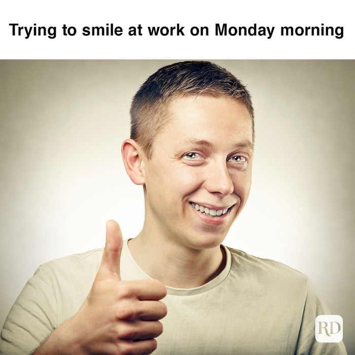 Trying To Smile At Work On Monday Morning 473868076
