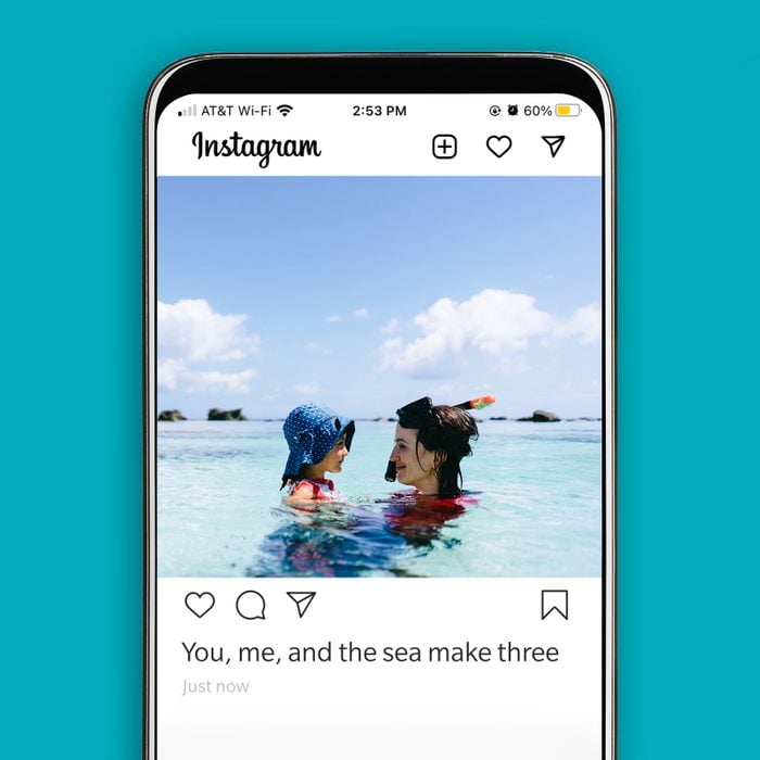 instagram screenshot displaying a mother and child playing in the ocean with a summer-y caption
