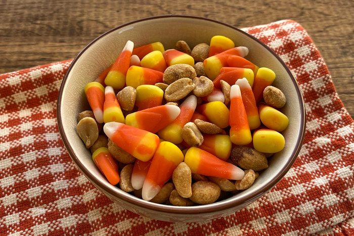 Candy corn and peanuts in bowl