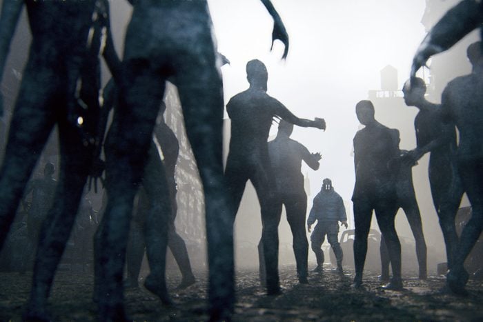 Zombie apocalypse survivor against hordes of undead