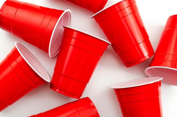 red solo cups scattered on white background