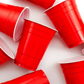 red solo cups scattered on white background