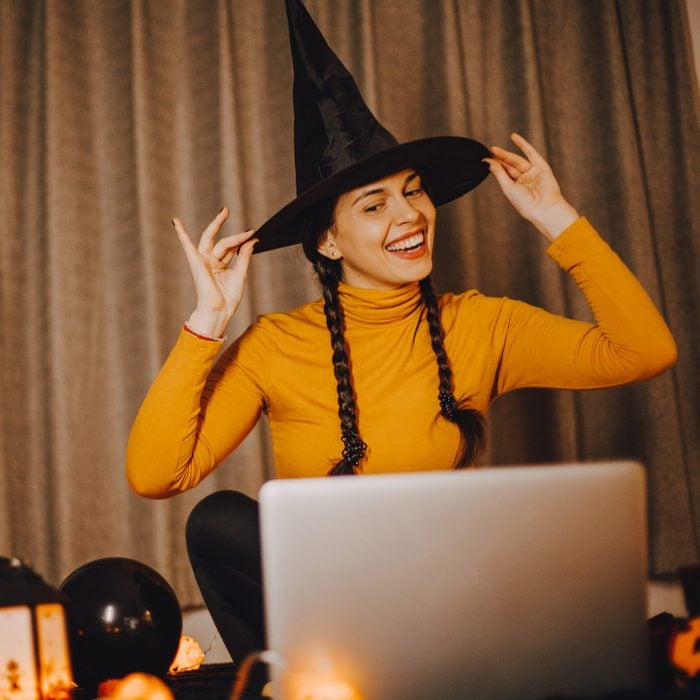 girl in witch halloween costume