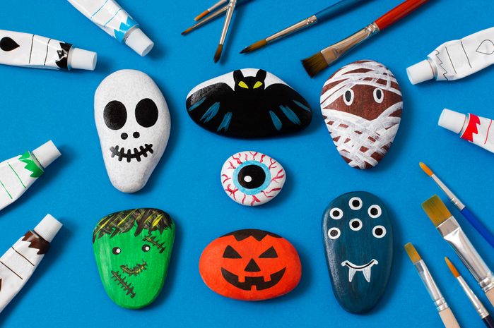 rocks decorated as halloween characters and art kids craft; skull, bat, mummy, eye, frankenstein, pumpkin, monster