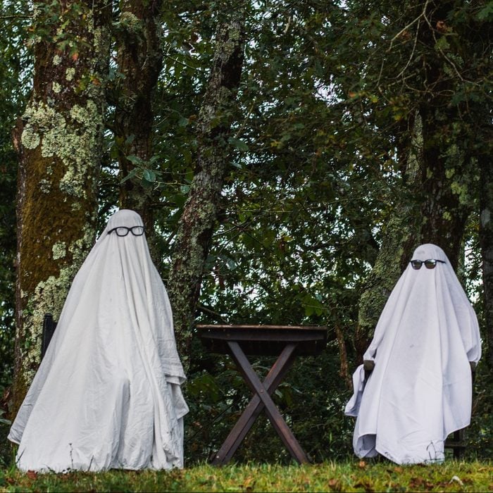two people dressed as ghosts for halloween