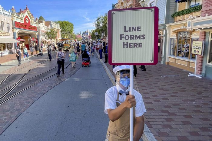 Disneyland employee wearing a facemark during reopening