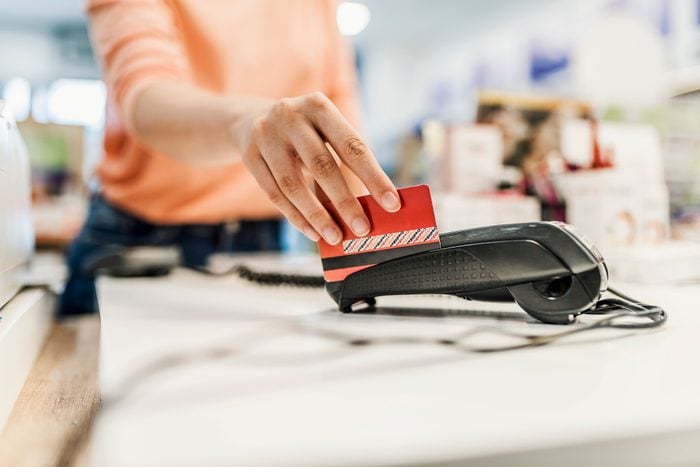 swiping credit card through machine