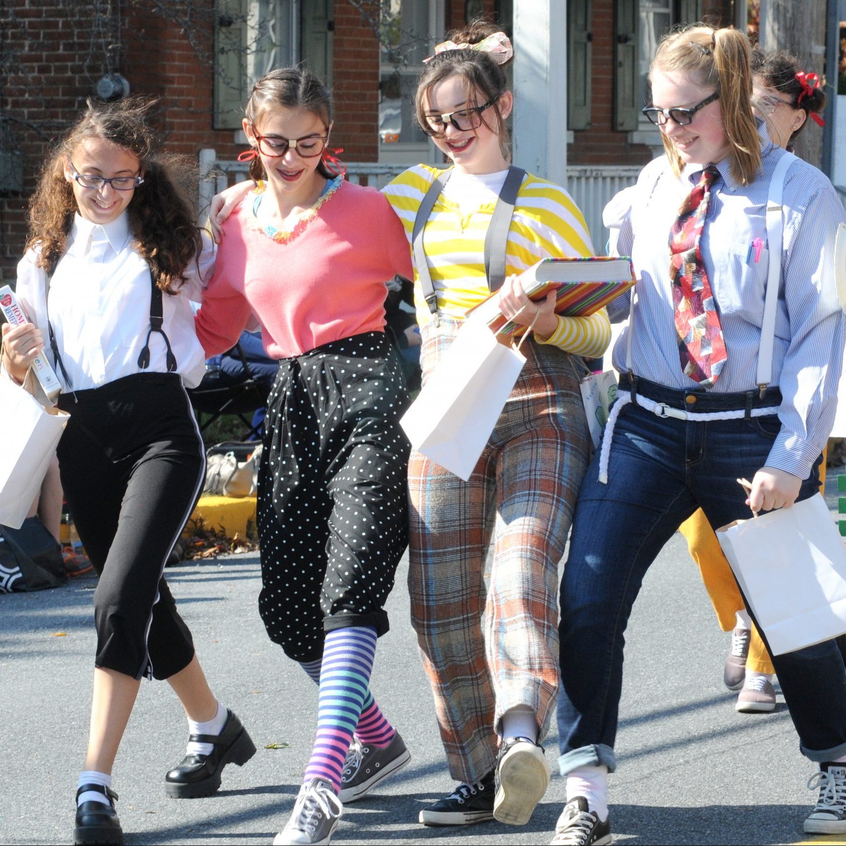 four young girls wearing nerd halloween costumes