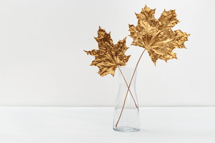 Gold painted leaves in glass