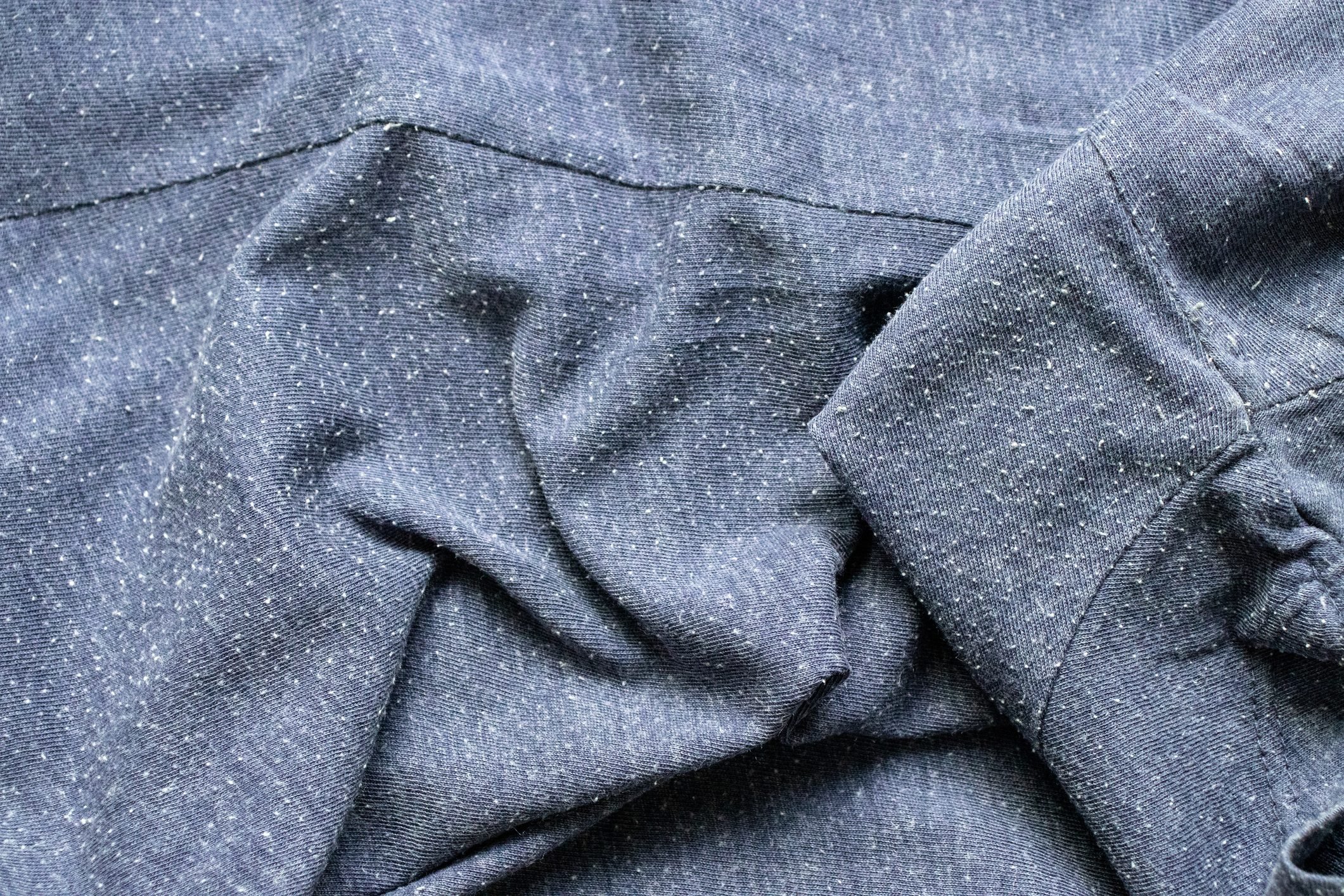 close up of pilling on gray sweater