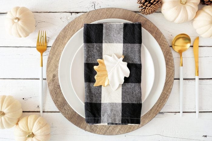 gingham plaid napkin on autumn table place setting