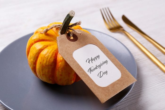 thanksgiving table name card on pumpkin