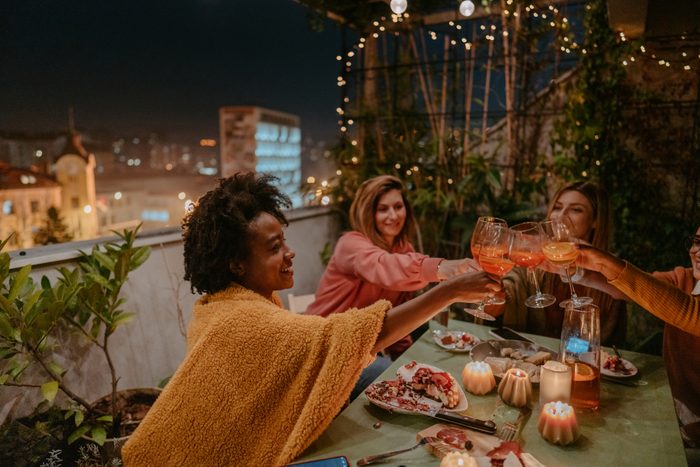 group of girls having dinner on a terrace