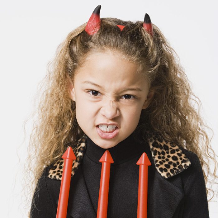 young girl dressed as a devil for halloween