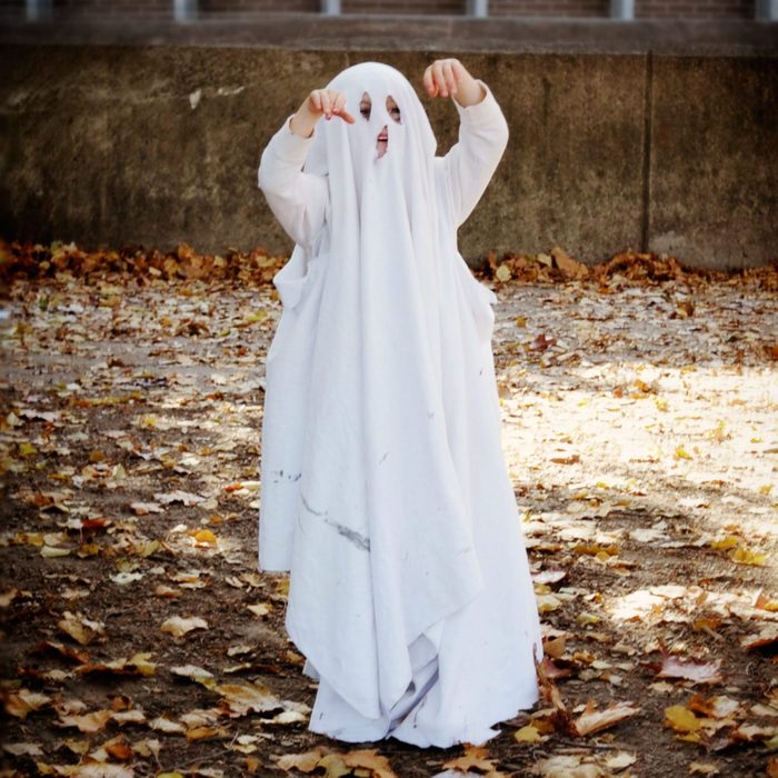 young child dressed as a ghost for halloween costume