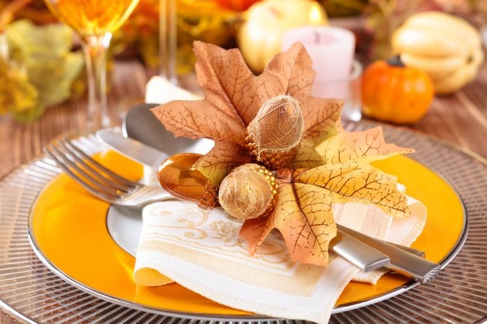 Thanksgiving dinner decoration with colorful accent plates