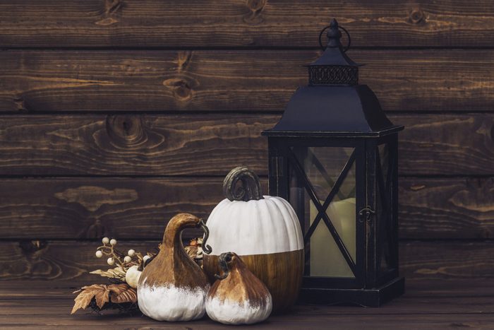 rustic lantern and pumpkin decor