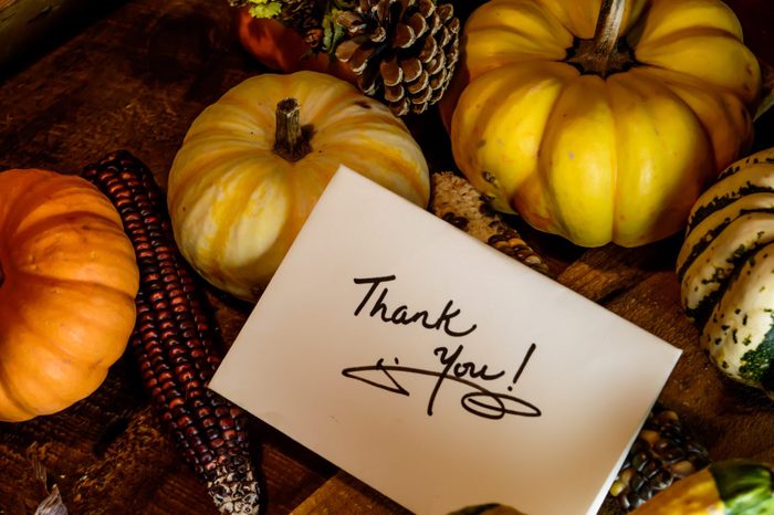 thanksgiving thank you card with pumpkins on table