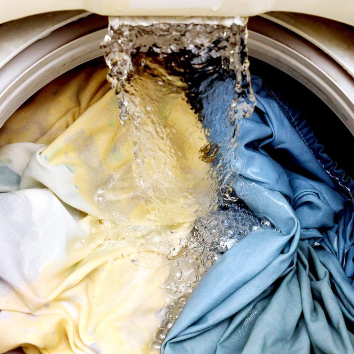 water filling a washing machine full of clothes