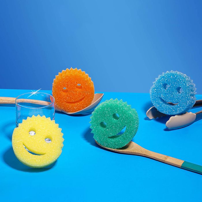 colorful Scrub Daddy Sponges On Blue Background