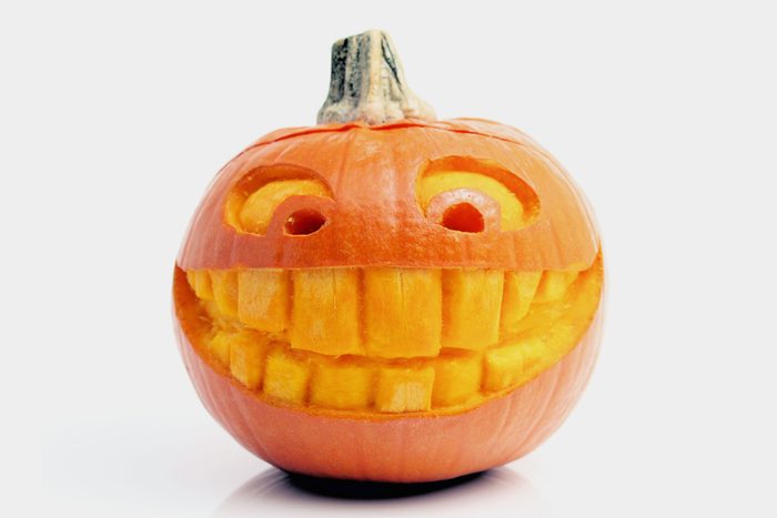 carved pumpkin with large toothy smile