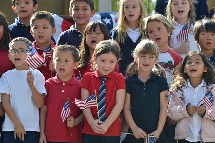 first graders sing the National Anthem during the Mark Twain Elementary School Veterans Day Celebration in Long Beach, Calif.