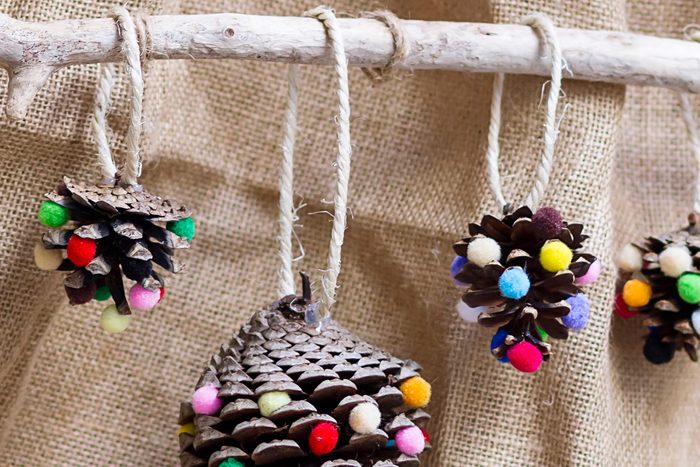 Christmas ornaments made with natural materials as pine leafs and wood
