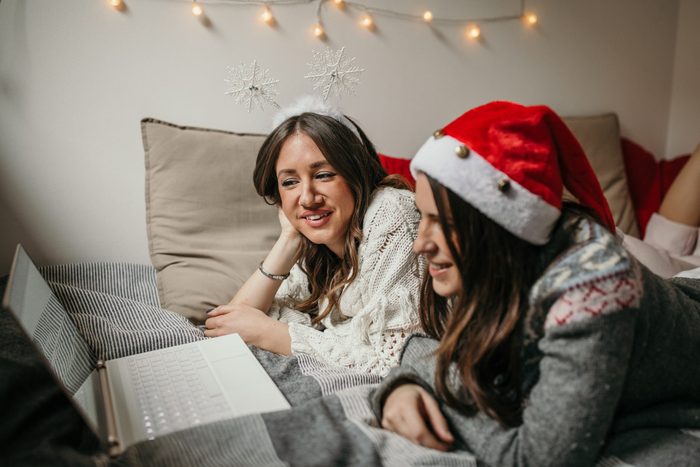 Two young woman watching christmas movies