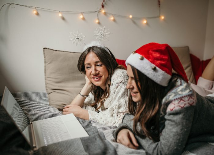 Two young woman watching christmas movies