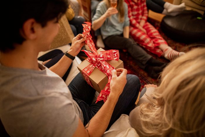 friends having a white elephant gift exchange party
