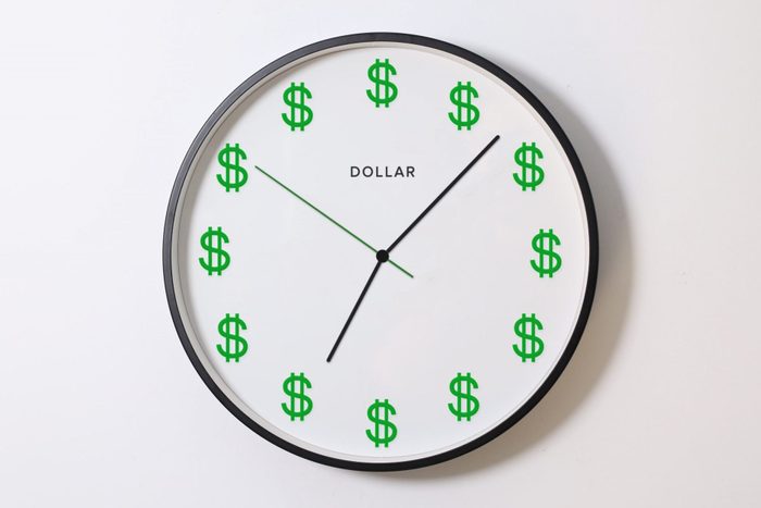A clock with green Dollar symbols instead of numbers